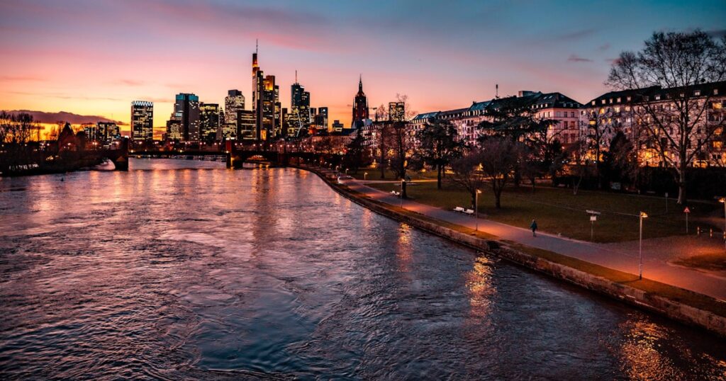 a river running through a city next to tall buildings